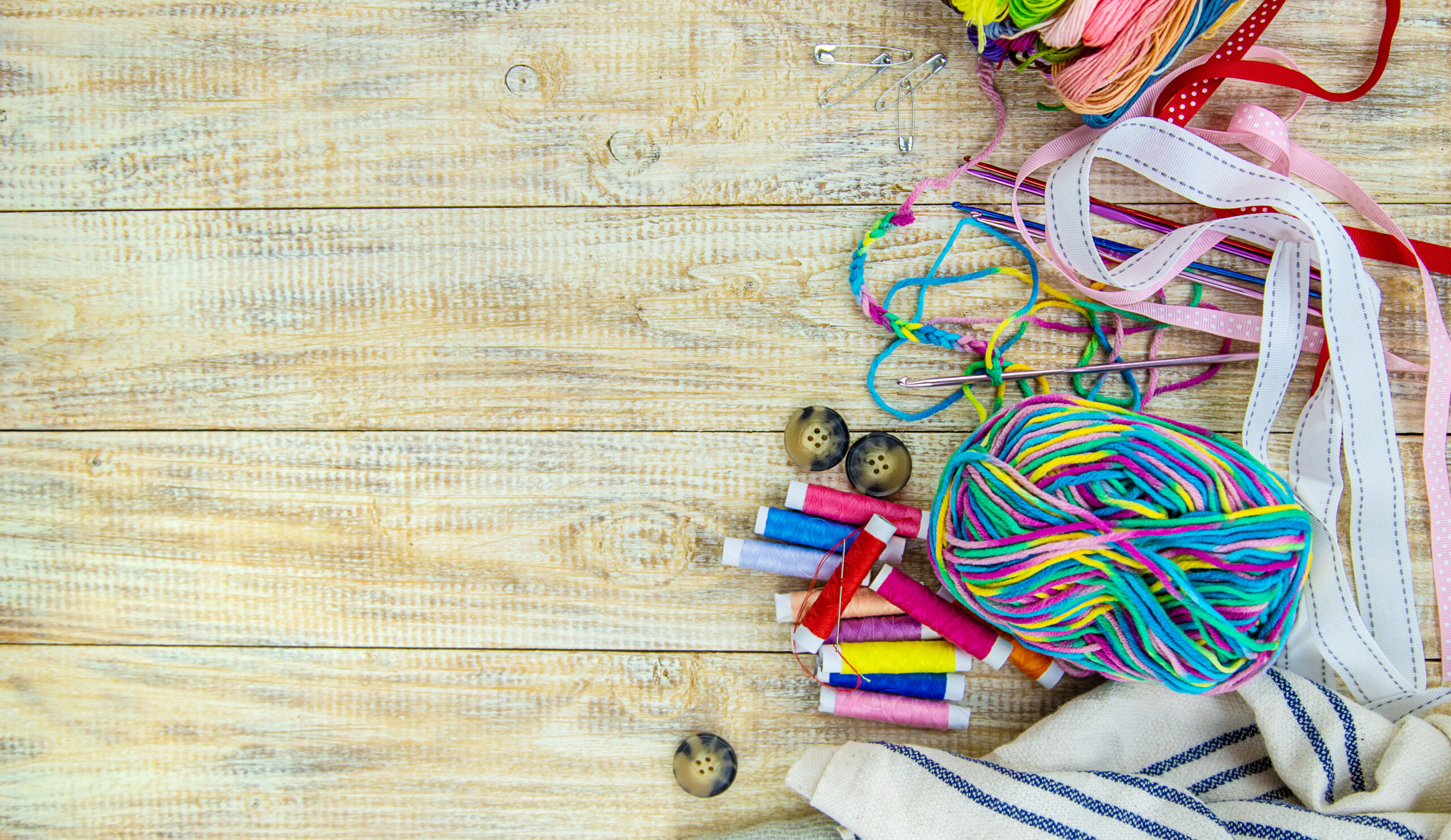 Threads and accessories for sewing and knitting. Selective focus. white.